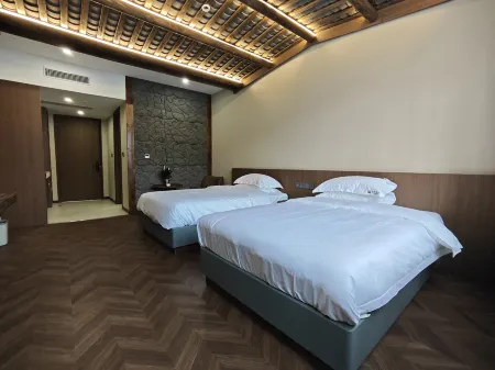 Jiaoxiang Manju Homestay (Longnan Wanxiang Street) Отели в г. Луннань