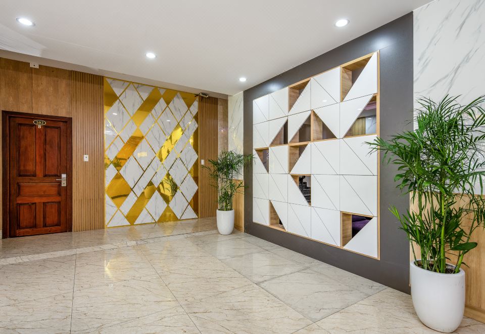 발렌시아 호텔 다낭의 템퍼-페딕 침대가 있는 객실 이미지