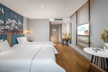 โรงแรมแม็กโนเทล ดงซิง กัวเหมินพอร์ต