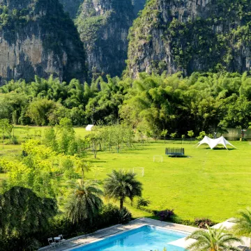 Qiyue Waterfront Vacation Apartment (Yangshuo Ten-Mile Gallery Yulong River) โรงแรมใกล้อูฐข้ามแม่น้ำ