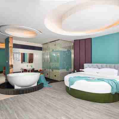 Joy Wanjia Hotel (Wuyi Mould City Jiayuan Plaza) Rooms