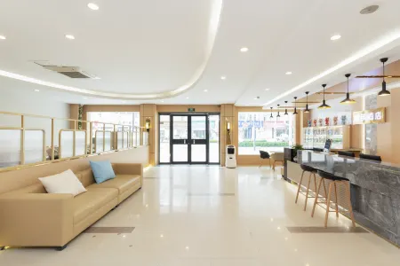 Shell Hotel (Xuzhou Xinyi Nanjing Road Railway Station) Отели в г. Синьи