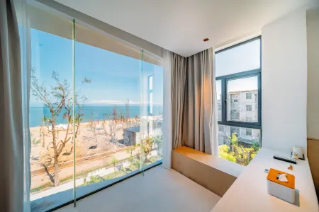 ESPOIR Xiwang Hotel (West Coast Rongshanliao Village) Отели рядом с достопримечательностью «Jinshawan Coastal Park»