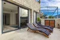 Seafront villa Kupinica with private indoor Pool - วิลล่า
