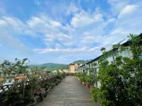 Mijng Qiyuan Minority Theme Hotel - พร้อมอาหารเช้า