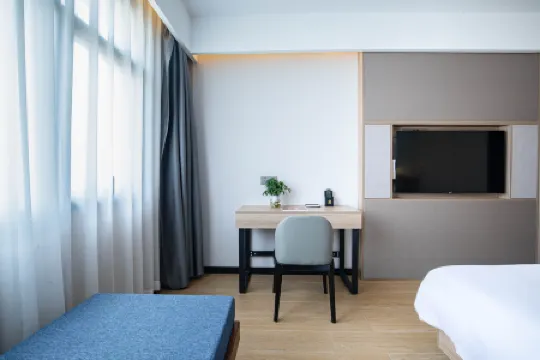 Yijiang Hotel (Wansheng Hotel) Отели рядом с достопримечательностью «Nantong Mining Industry Company Workers Culture & Sport Center»