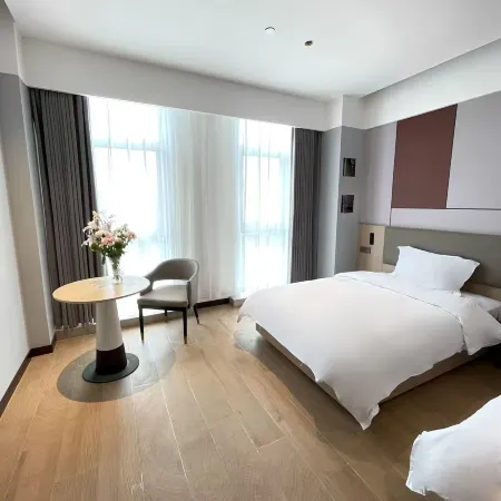 Kaiwo Apartment Hotel (Shanghai Lingang Shuyuan Yuzhou City Plaza) Отели рядом с достопримечательностью «Озеро Дишуй»