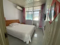 Xinggang Hotel - Homestays