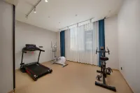 Yilong Ruiyun Hotel (Xinyang Railway Station Tianrun Square Branch) - ที่มีฟิตเนส