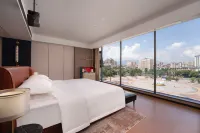 Soluxe Hotel (Xishuangbanna Jinghong Water Splashing Square Riverside Night Market Branch) - Pet friendly
