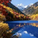Jiuzhaigou · Mistshroud Mountains & Sunset Glow Snowscape · Sukoon Village - Vuoristonäköala