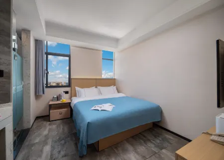 Flora Hotel (Kunming Chenggong Dounan Flower Market) Отели рядом с достопримечательностью «Luolong Park»