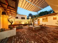 Muzi's Courtyard (Two Rivers & Four Lakes East-West Alley Branch)