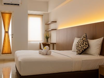 Quintessa Room at Candiland Apartement