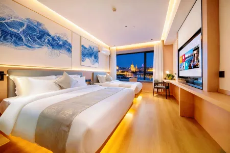 Puju Hotel (Qujiang International Conference Center Store) Отели рядом с достопримечательностью «Xi'an Eurasia University»