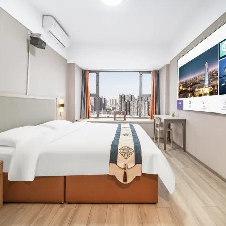 Muguang Hotel Отели рядом с достопримечательностью «Школа Чуньхуа, Новый район, Цуэндун»