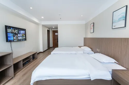 Xinbaixin Hotel (Meihekou Railway Station Branch) - parking
