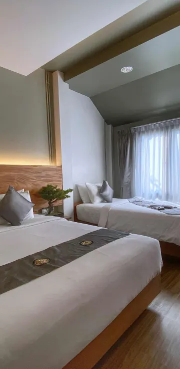 ห้องสำหรับสามท่านพร้อมเตียงใหญ่และเตียงเดี่ยว