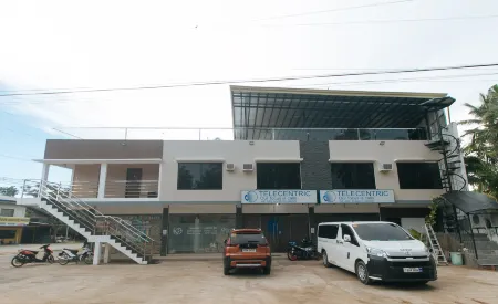 RedDoorz @ Happy Stay Apartelle Отели рядом с достопримечательностью «Панглао»