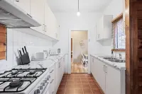 Rustic Rooms – Easy Access to Train & Amenities