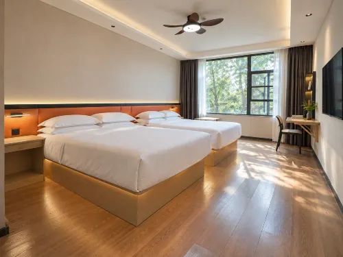 Huajian Meisu Hotel (Xinyang Railway Station Tianrun Plaza) - Lãng mạn