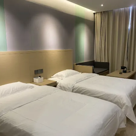 Xinzheng Mike Hotel (Zhengzhou Vocational College of Technology) Отели рядом с достопримечательностью «Синхайская больница»