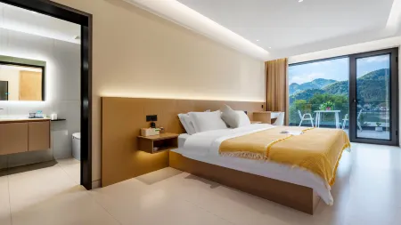 Woodpecker Homestay Отели рядом с достопримечательностью «Shanmendong Sceneic Area»