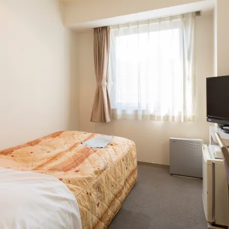 Business Hotel East Park Ritsurin Отели рядом с достопримечательностью «Выставочный центр Sun Messe Kagawa»