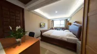 Weihai Gujie Anyi Hotel (Weigao Plaza Xingfumen)
