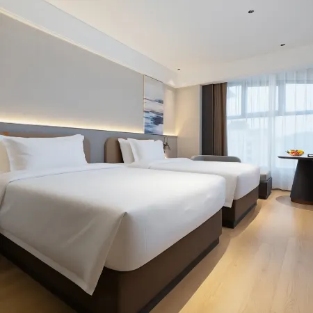 EZZI Hotel (Xinhong Port Trade Center) Отели рядом со станцией Yalongwan Railway Station