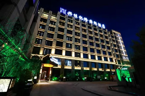 Xingjia Yilong Hotel - parking