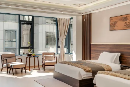 Songlan Qishe Hotel Отели в г. Юншэн