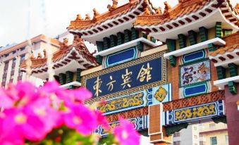 The city has a variety of different types of buildings on its streets, including an Asian temple at Dong Fang Hotel