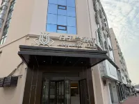 Magnolia Business Hotel (Qingdao May Fourth Square Hisense Plaza Branch) Hotels in Qingdao