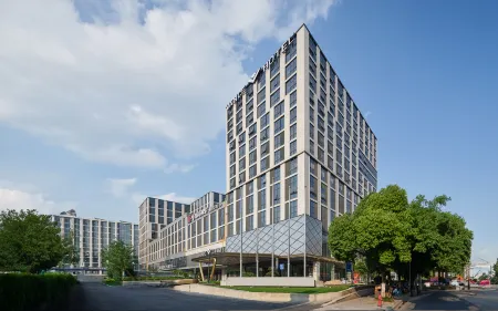 Vance Hotel (East Railway Station Airport Road Branch) Отели рядом с достопримечательностью «Caozhuang Park»