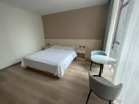 Mufeng Hotel (Xinzheng Longan Community Sanhaoyuan)