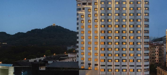 Quanji Hotel (Yichun Municipal Government) Отели в г. Ичунь
