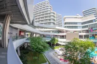 Oscar·ing Future Print Light Stay (Guangzhou Olympic Sports Center Huangcun Metro Station Branch) Hotel a 