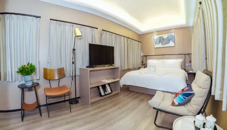 Green Train Leisurely Time Отели рядом с достопримечательностью «Longchuan Square»