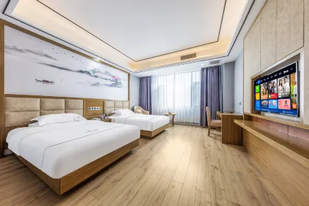 Heyue Hotel (Linyi Yunxian High speed Railway Station Store) Отели в г. Юньсянь