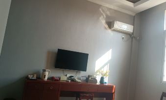 Yuanmou Aiweike Business Hotel