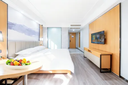 Qingmu Platinum Hotel (Guanghan Bailun Square Tianjie Branch) Отели в г. Гуанхан