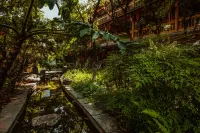 昆明米蘭小築客棧（西山滇池海埂民族村店） Отели рядом с достопримечательностью «Футбольная база Куньмин Хай-Хай в провинции Юньнань»