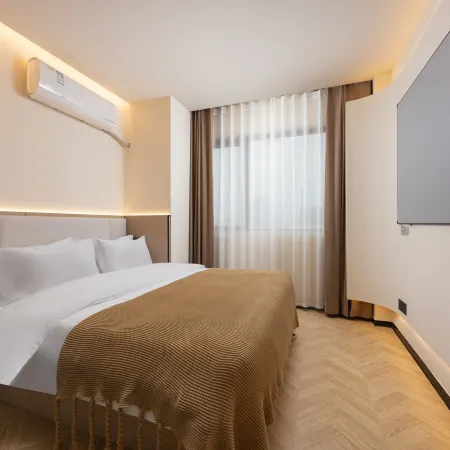 Wutong pomelo hotel (jiaxing nanhu huafu eight hundred companion store） Отели рядом с достопримечательностью «Jiaxing University Biology and Chemistry Engineering College»