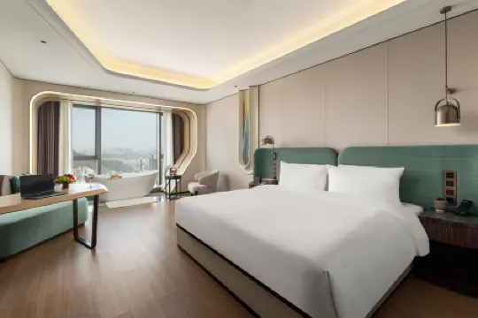 Kuanrong Suite Hotel (Chimelong Wanda Store in Panyu, Guangzhou) Отели рядом с достопримечательностью «Chimelong Paradise»