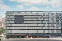 Orange Hotel(Wuxi Xingguangli Branch) Отели в г. Зона развития высоких технологий