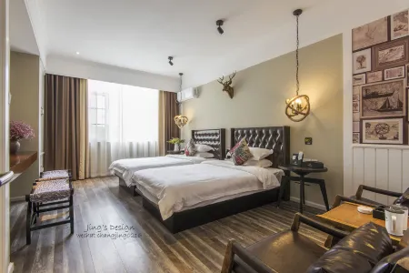 Qing Niao Yi Shu Hotel Отели рядом с достопримечательностью «Kunming University of Technology Chenggong Campus College of Mechanical and Electrical Engineering»