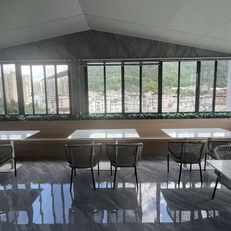 Muqi Jiushe Design B&B (Longyan Railway Station Minxi Trading City)
