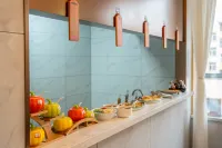 Magnotel Magnolia Hotel (Jiamusi Railway Station New Mart) - sarapan
