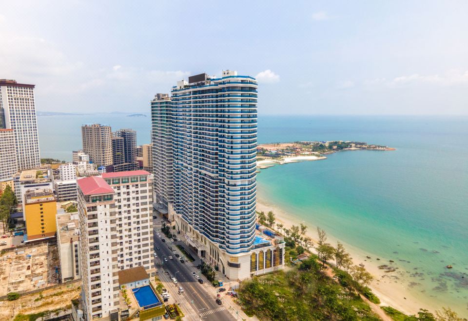 The city offers an aerial view with tall buildings and the ocean in the foreground or background at Howard Johnson Plaza by Wyndham Blue Bay Sihanoukville